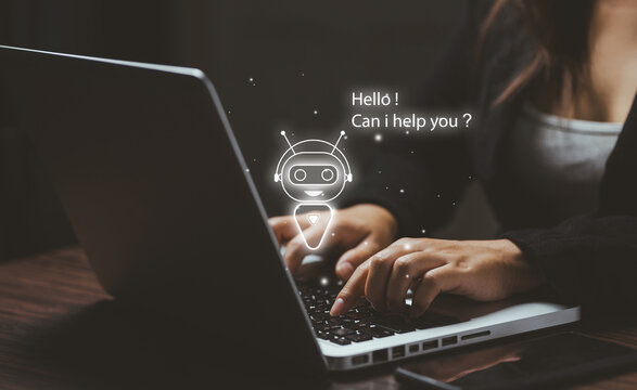 A user typing on a laptop with a glowing AI chatbot icon, symbolizing virtual assistants, automated support, customer service AI, and intelligent digital communication.