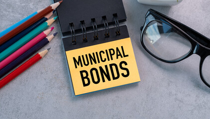 A yellow piece of paper with the word Municipal Bonds written on it