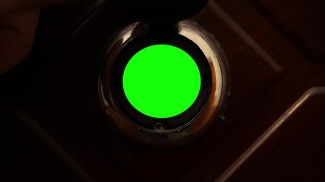 Man opening the chroma key green screen of a door peephole. POV
