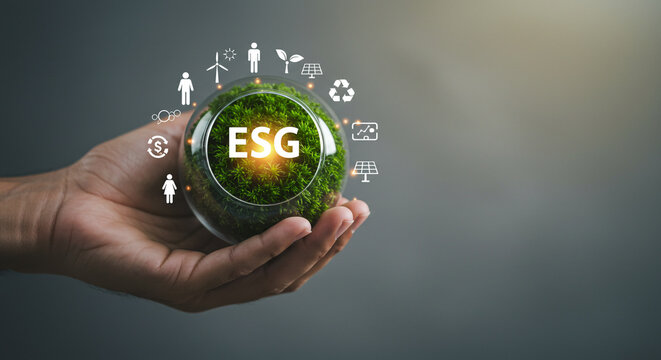 Sustainable business growth concept with ESG principles and green energy icons held in hand