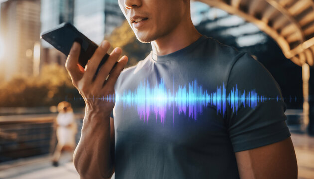 Smart Communication: A man in athletic attire utilizes voice activation technology on his smartphone to send a voice message, emphasizing the seamless integration of technology with daily life.