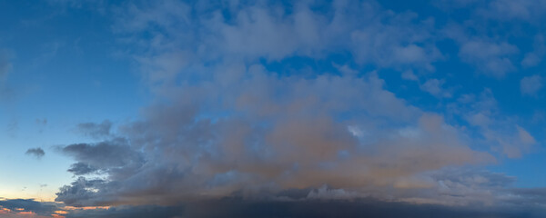 Serene Sunset Sky Over Calm Horizon With Soft Clouds And Blue Light