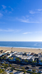 Obraz premium Aerial shot along the coastline with homes a sandy beach in Newport Beach California USA