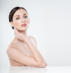 Beautiful young woman with clean skin nude topless breasts. Beautiful woman covering her nude breast. beautiful female figure. perfect skin.