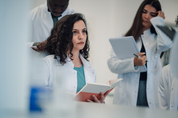 Science student learning in concentration during lecture