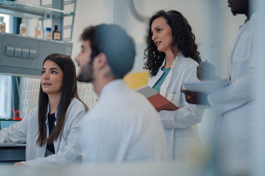 Diverse team of scientists collaborating in laboratory