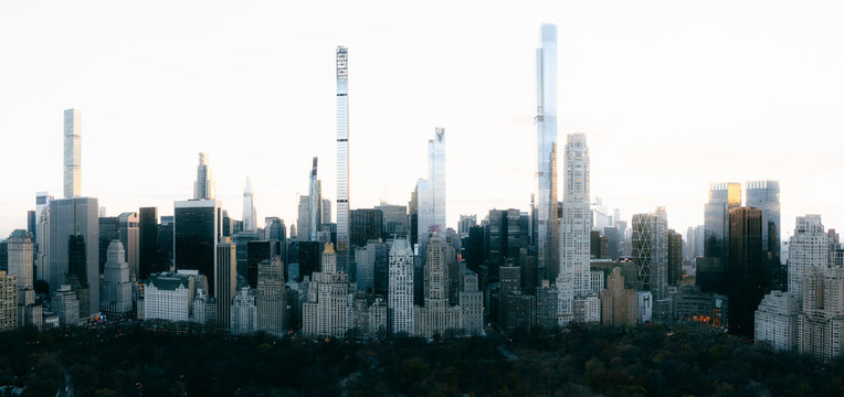Aerial view of skyscrapers piercing the sky, casting long shadows over the city, a blend of modern architecture and nature, New York, New York, United States. - Powered by Adobe