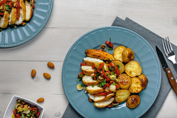Sliced Chicken Fillet with Herb Potatoes and Pepper Salsa