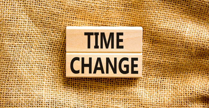 Time change symbol. Concept word Time change on beautiful wooden blocks. Beautiful canvas background. Business time change concept. Copy space.
