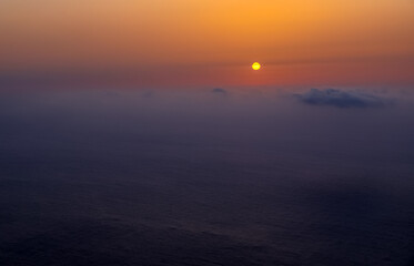 Obraz premium Sunset landscape over the Atlantic Ocean. Sunset and sunrise time, nature background and empty area for text, feeling love or romantic background in nature, sky background with clouds