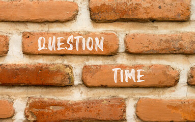 Question time symbol. Concept words Question time on beautiful brown brick wall. Beautiful brown brick wall background. Business and question time concept. Copy space.