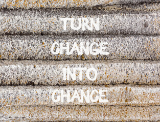 Turn change into chance symbol. Concept words phrase Turn change into chance on beautiful grey stone wall. Beautiful stone wall background. Business Turn change into chance concept. Copy space.