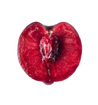 Close-up of juicy red cherry half isolated on transparent background