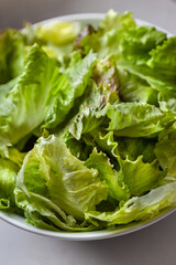 Green salad in a white bowl