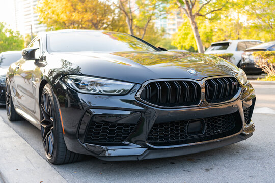 Miami, Florida, USA - April 17, 2025: Luxury car BMW M8 Competition. Car BMW M8 Competition parked outdoor. Black color car, corner view. 2020 BMW M8 Competition car