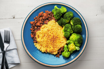 Overhead View of Lentil Shepherd’s Pie Dinner with Broccoli