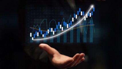 A business professional holds a digital overlay chart, showcasing significant upward trends. This visual representation symbolizes growth and analysis in the market. Copula