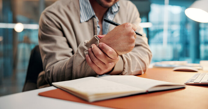 Wrist pain, strain or hands in office with notebook, burnout or joint inflammation in carpal tunnel. Ache, man and employee in agency with writing, muscle tendinitis or arthritis in overwork.