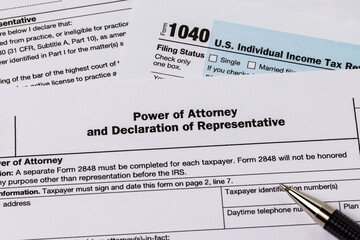Power of attorney form for federal income tax return. Tax preparation, filing taxes and tax law concept.