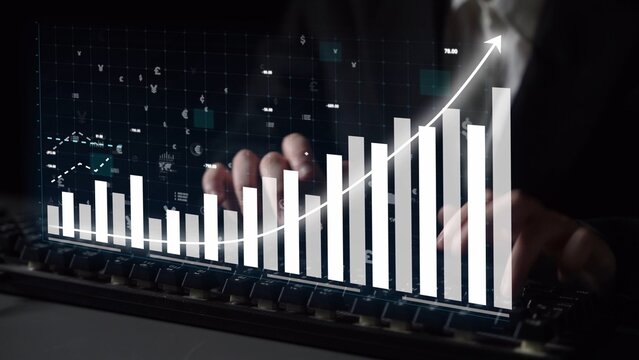 A business professional examines financial growth data using a digital chart showcasing an upward trend, highlighting success and innovation in a corporate setting. Copula