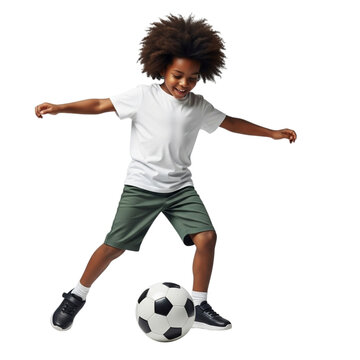 Young boy with curly hair playing soccer on a black background