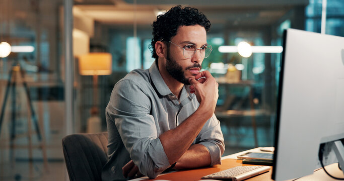 Night, media agency and man with computer, thinking and creative project with choice. Person, evening and journalist with decision, ideas or article submission with publishing, wonder or website blog