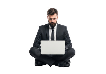 Focused businessman wearing a formal suit and tie sitting cross legged with a laptop isolated on transparent background