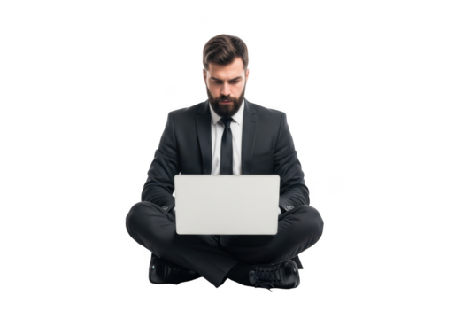 Focused businessman wearing a formal suit and tie sitting cross legged with a laptop isolated on transparent background