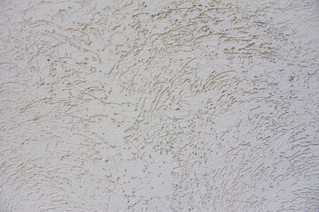a close-up of a scratched wall texture. The texture resembles grooves and ridges, for web design, social media, backgrounds