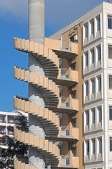 Fototapeta premium External Concrete Spiral Stairs Building Fire Escape