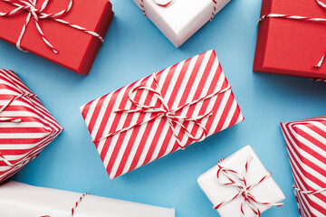 Color gift boxes on color background, flat lay