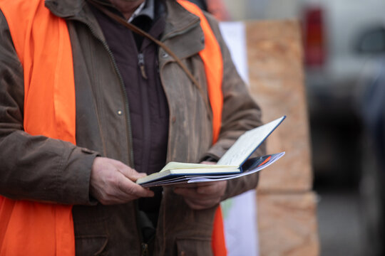 Hunter reading notes during safety briefing