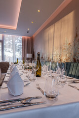 Elegant restaurant table setup with wine and glassware
