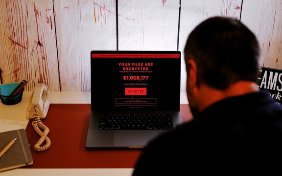 Middle Aged Executive Working From Home Falls Victim to ClickFix Captcha Black Hat Cybersecurity Attack - Educational Ransomware Hack Concept