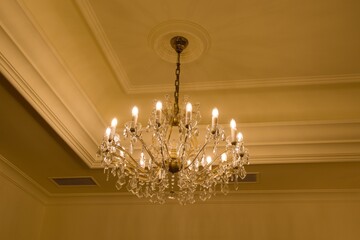 old historical crystal ceiling light in a palace