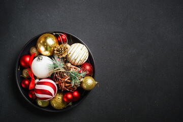 Christmas holiday decorations on black.