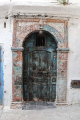 Traditional Moroccan Wooden Door with Archway