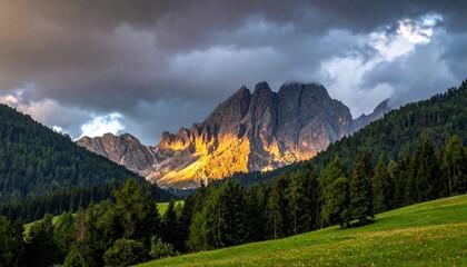 Dramatic mountain peaks with golden light.