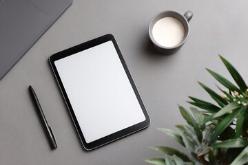 Modern minimalist workspace with a tablet, laptop, coffee, and plant, ideal for productivity and creative work.
