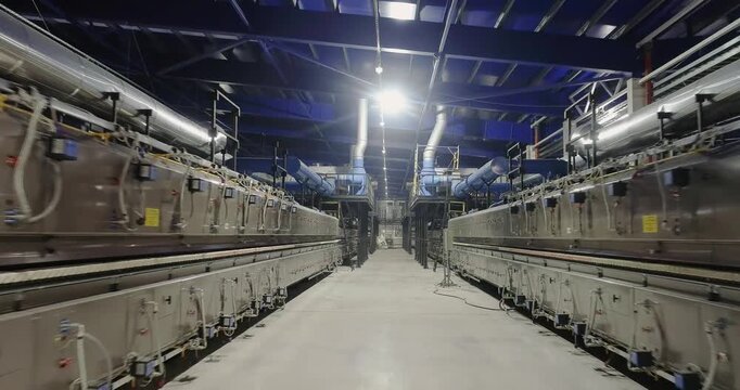 Ceramic Tile Roller Kiln. A production line or conveyor at a ceramic and porcelain tile factory. Firing. Ceramic Tile Making. Manufacturing process of ceramic tiles. Interior. Inside. Indoor