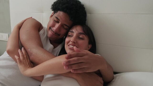 Happy Couple Cuddling in Bed