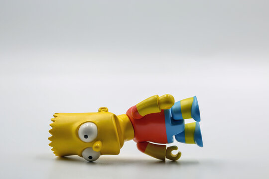 Bart Simpson toy figure closeup on white background.