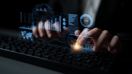 A professional hands-on keyboard interacting with futuristic projections of data metrics, charts, and graphs, illustrating the world of business analysis and digital insights. Scalp
