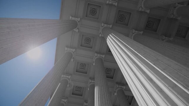 Classical marble columns and coffered ceiling viewed from below. 3D animation of a government building, bank, or courthouse portico against a blue sky with bright sun.