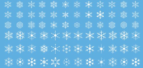 Delicate snowflakes falling softly on a serene light blue background, perfect for winter holiday designs and frosty seasonal greetings