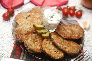 dish grilled popatoes draniki with vegetables and tomatoes