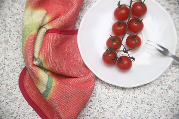cherry tomatoes on a white plate