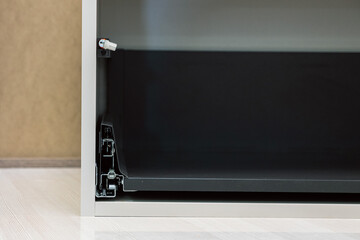 close-up of a drawer slide mechanism. Concept of smooth operation, engineering, and functional design is conveyed.