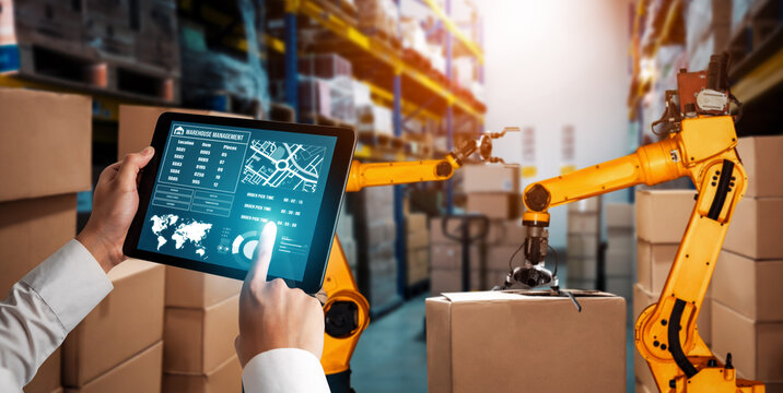 Smart robot arm systems for innovative warehouse and factory digital technology . Automation manufacturing robot controlled by industry engineering using IOT software connected to internet network .