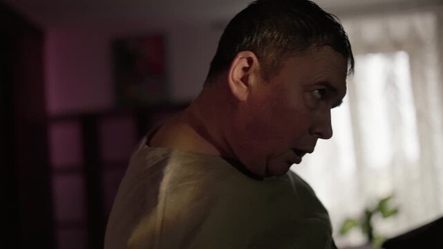A drunk man walks staggering left and right. A drunk guy in a straitjacket has delirium tremens, tremors, and bipolar disorder.